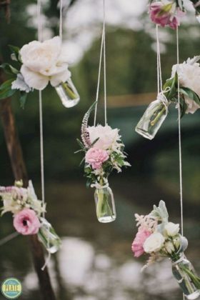 Hanging Bottles With Fresh Flowers